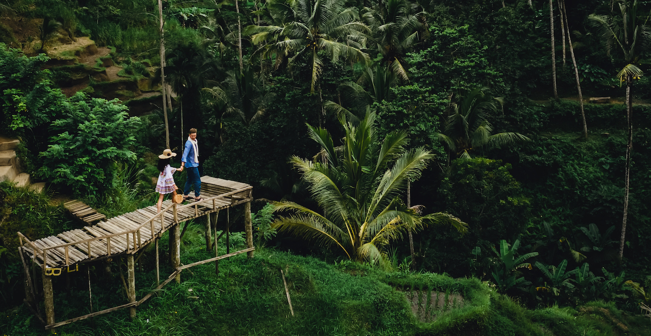 couple standing on wooden bridge near rice terrace 2023 11 27 05 30 31 utc